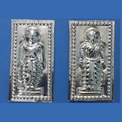 Two silver plates side by side with an inscription of male on the left one and inscription of female on the right one